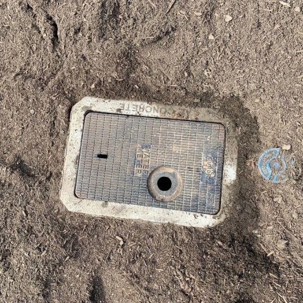 An unobstructed in-ground water meter cover