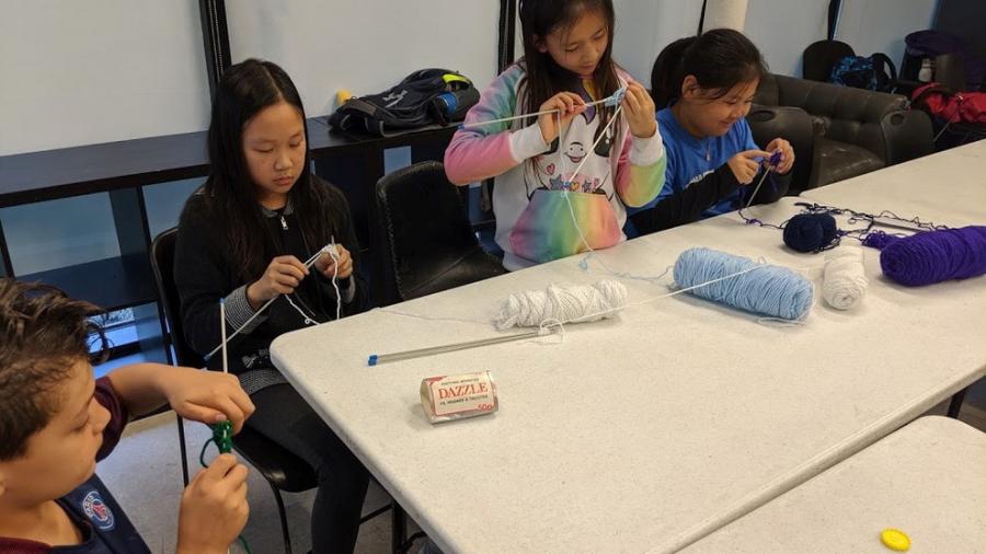 Kids knitting in a MYzone class.