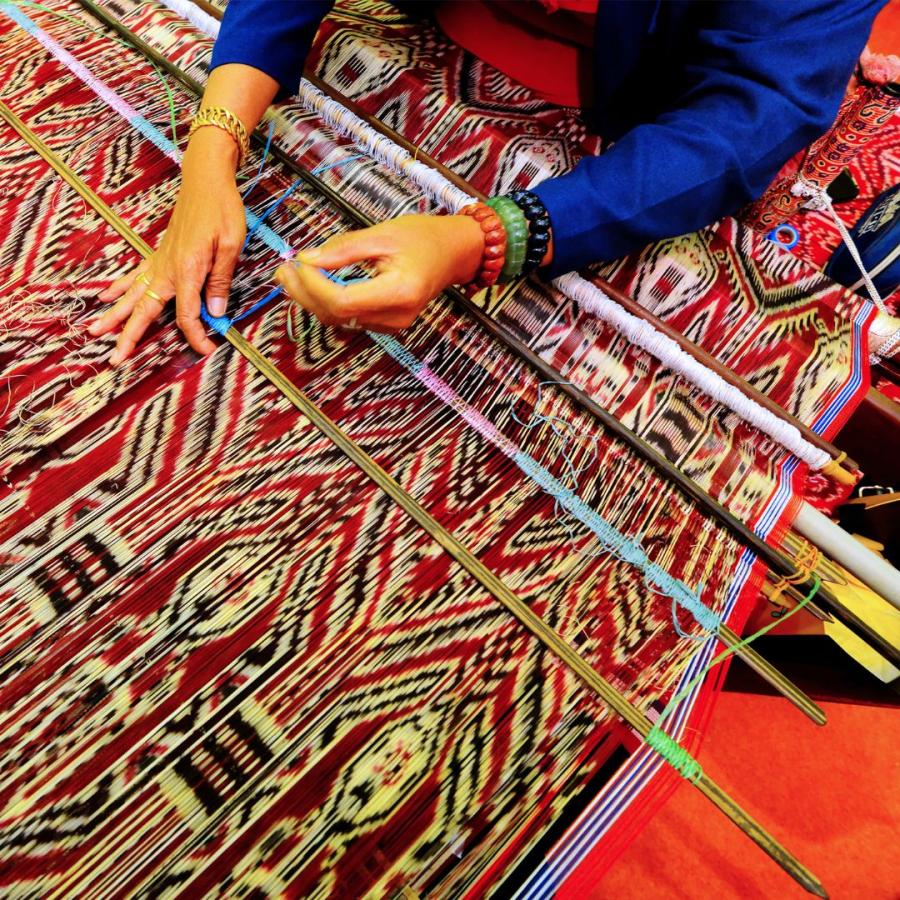 A working textile on a loom