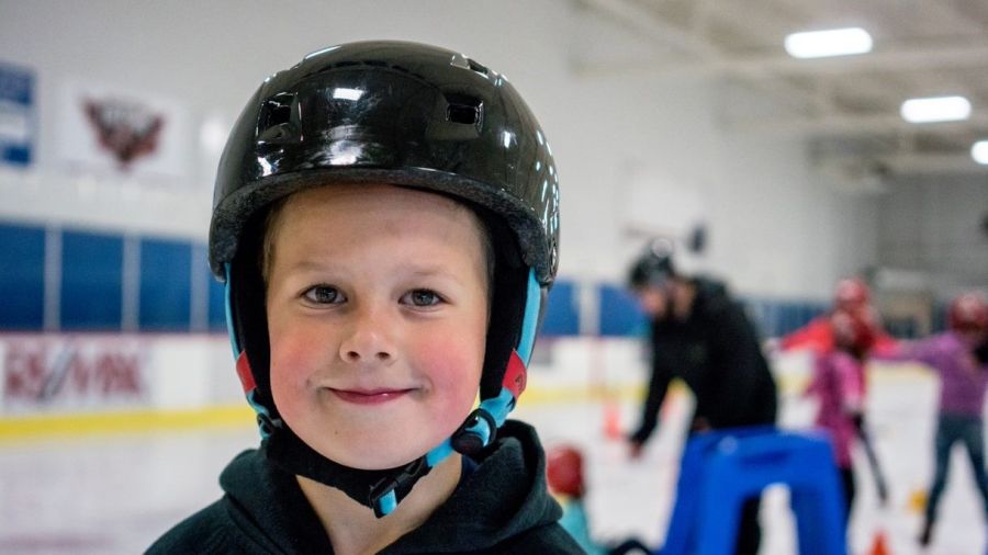 a child with helmet at public skate