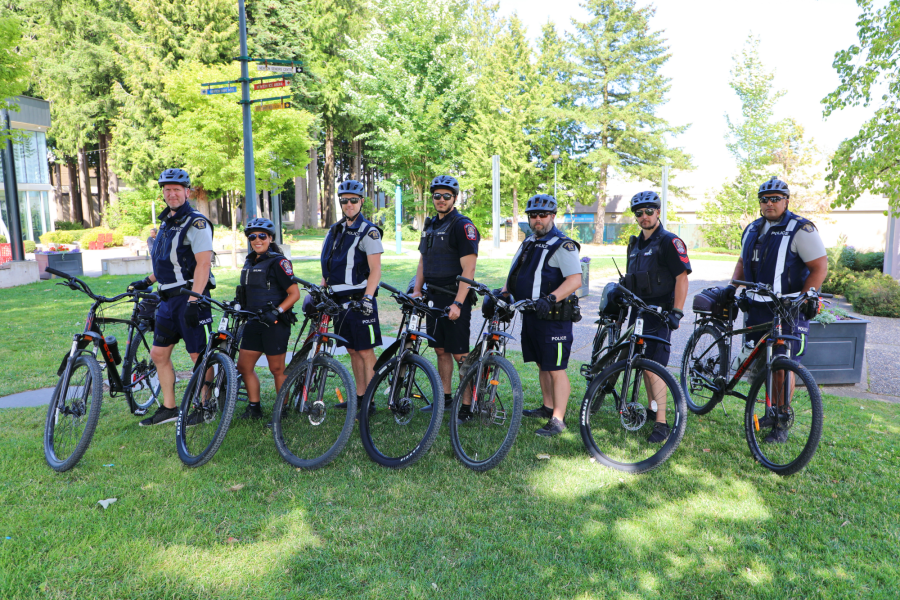 bylaw and RCMP officers on bikes