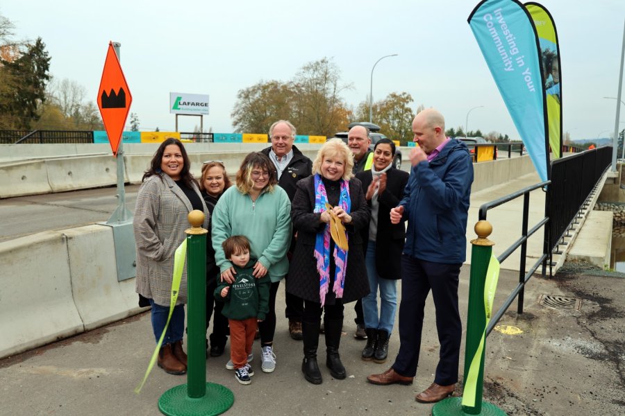 Mayor Brenda Locke cuts the ribbon at the opening ceremony for the new Nicomekl River crossing on Nov. 15, 2023. From left: Kwantlen First Nation artist Phyllis Atkins, Semiahmoo First Nation artist Joan Williams (green sweater), Councillor Mike Bose, Councillor Doug Elford, Councillor Pardeep Kooner and Jeff Busby, VP of Engineering for TransLink.