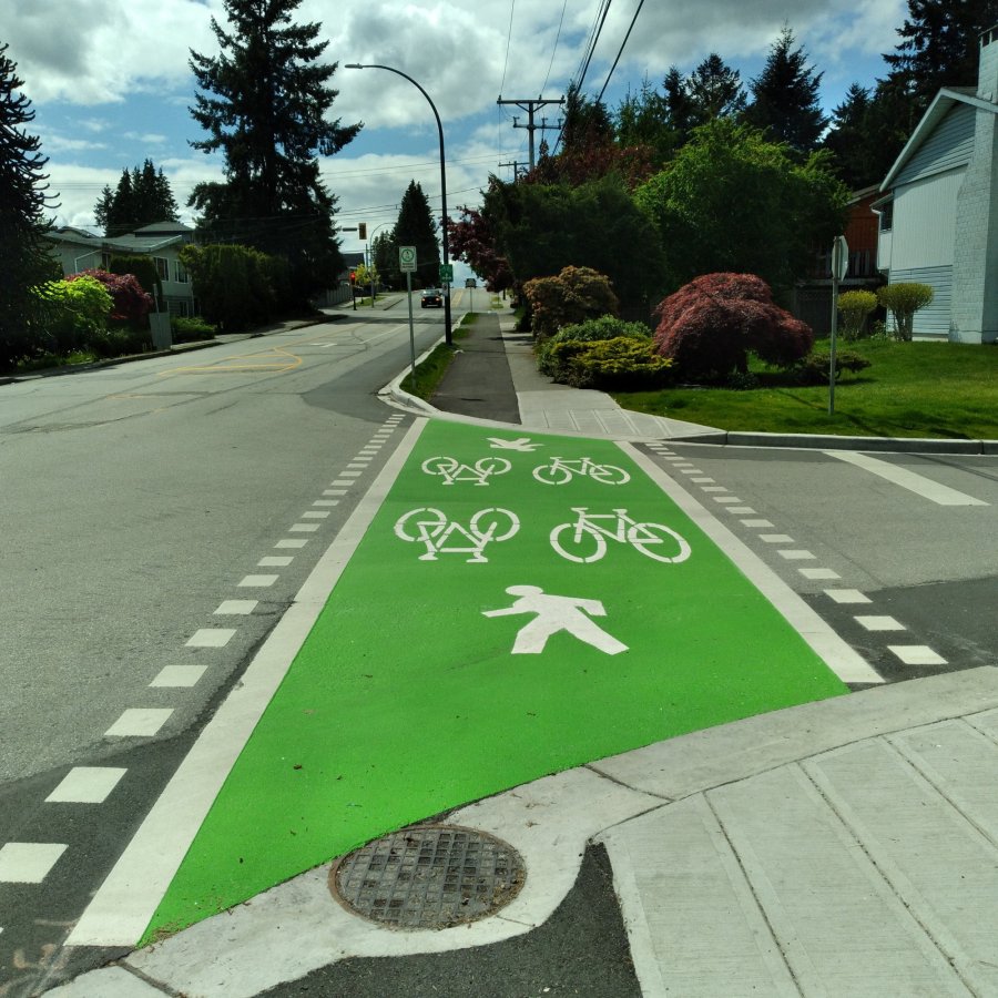 a green crosswalk for multi use path