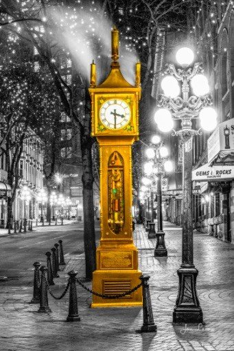 A golden clock on a city street